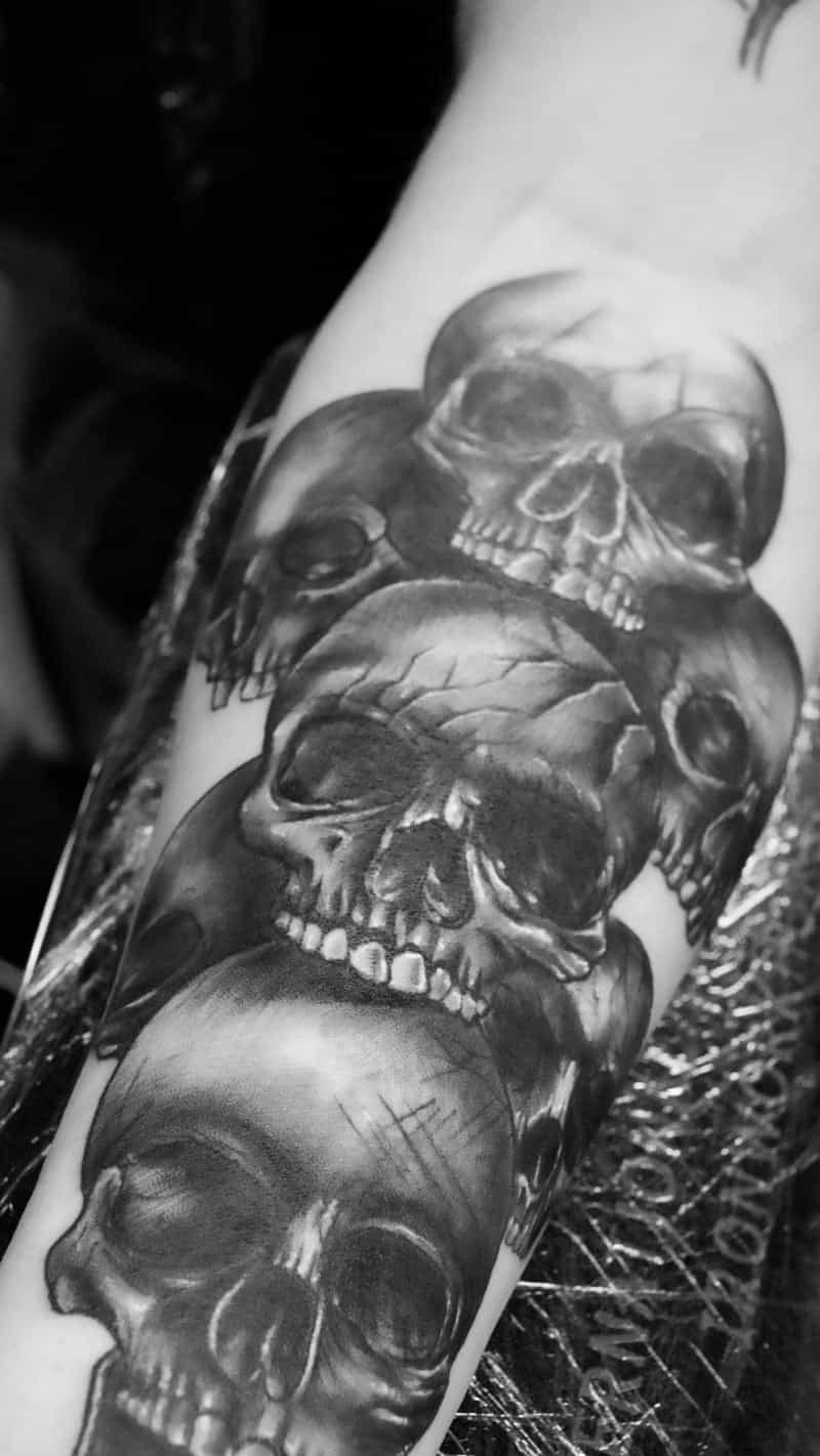 Black and grey realistic skull cluster tattoo - Laurel MD