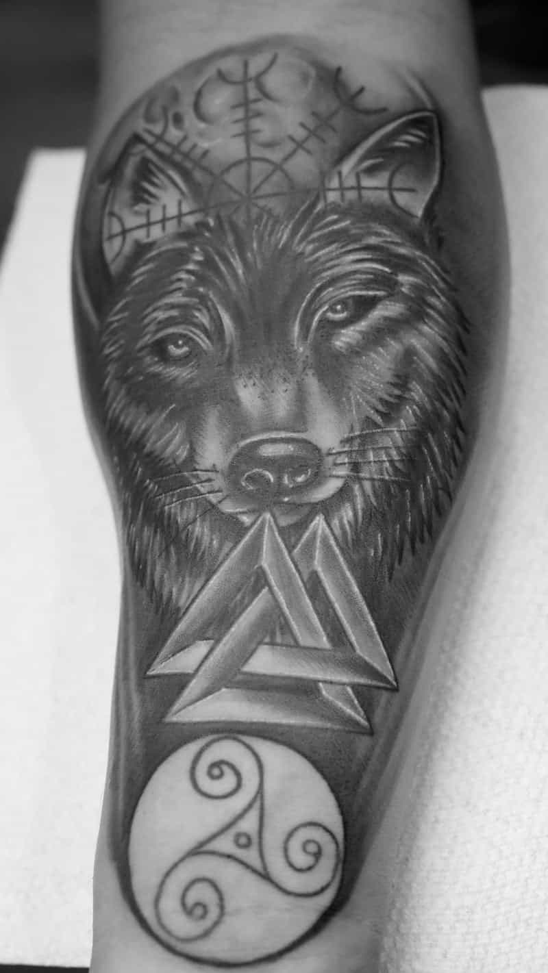 Black and grey realistic wolf with Norse symbols tattoo - Laurel MD
